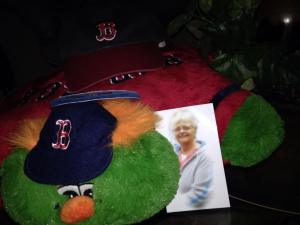 My mother watched the games from Florida with her hat, her Wally, and a photo of Linda by her side.